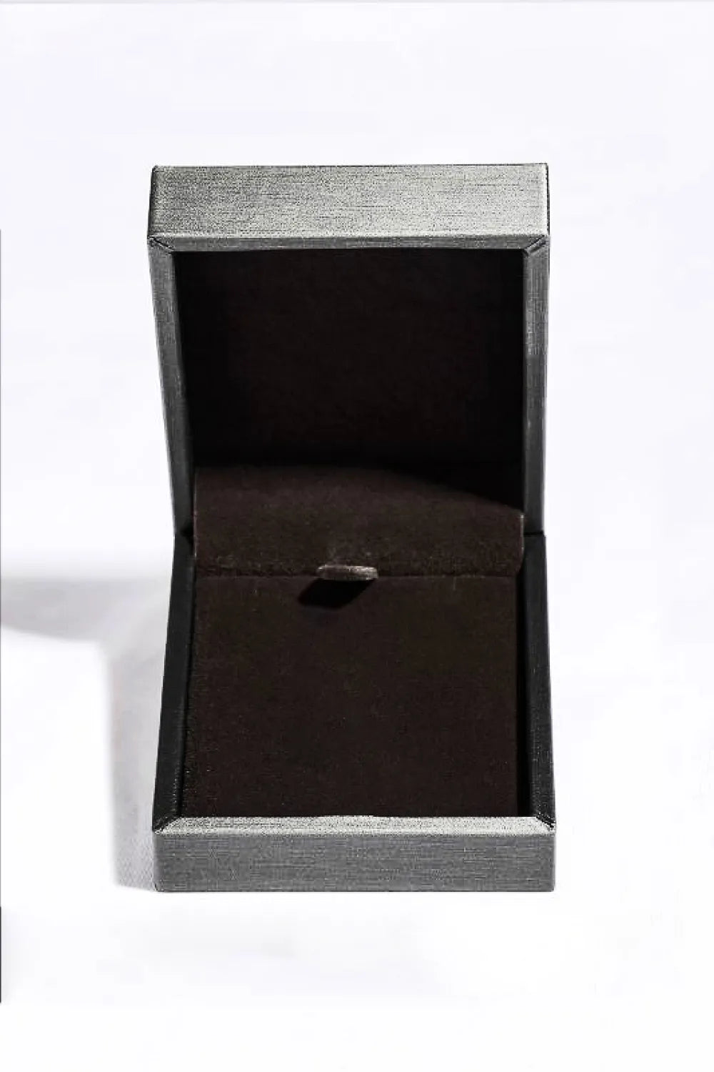 Black jewelry box with a silver clasp on a white background