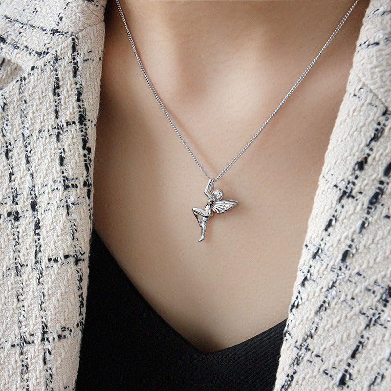 Silver fairy pendant necklace on a mannequin