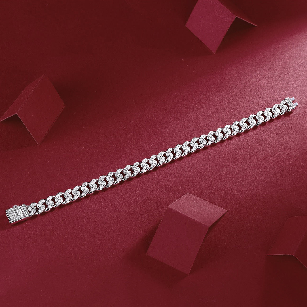 Silver bracelet on a red background