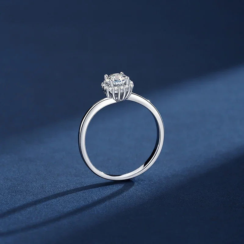 Silver ring with a diamond on a blue background