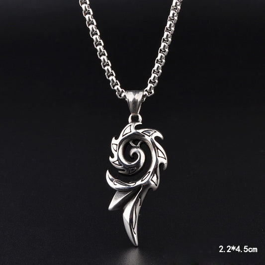 Silver spiral pendant necklace on a black background