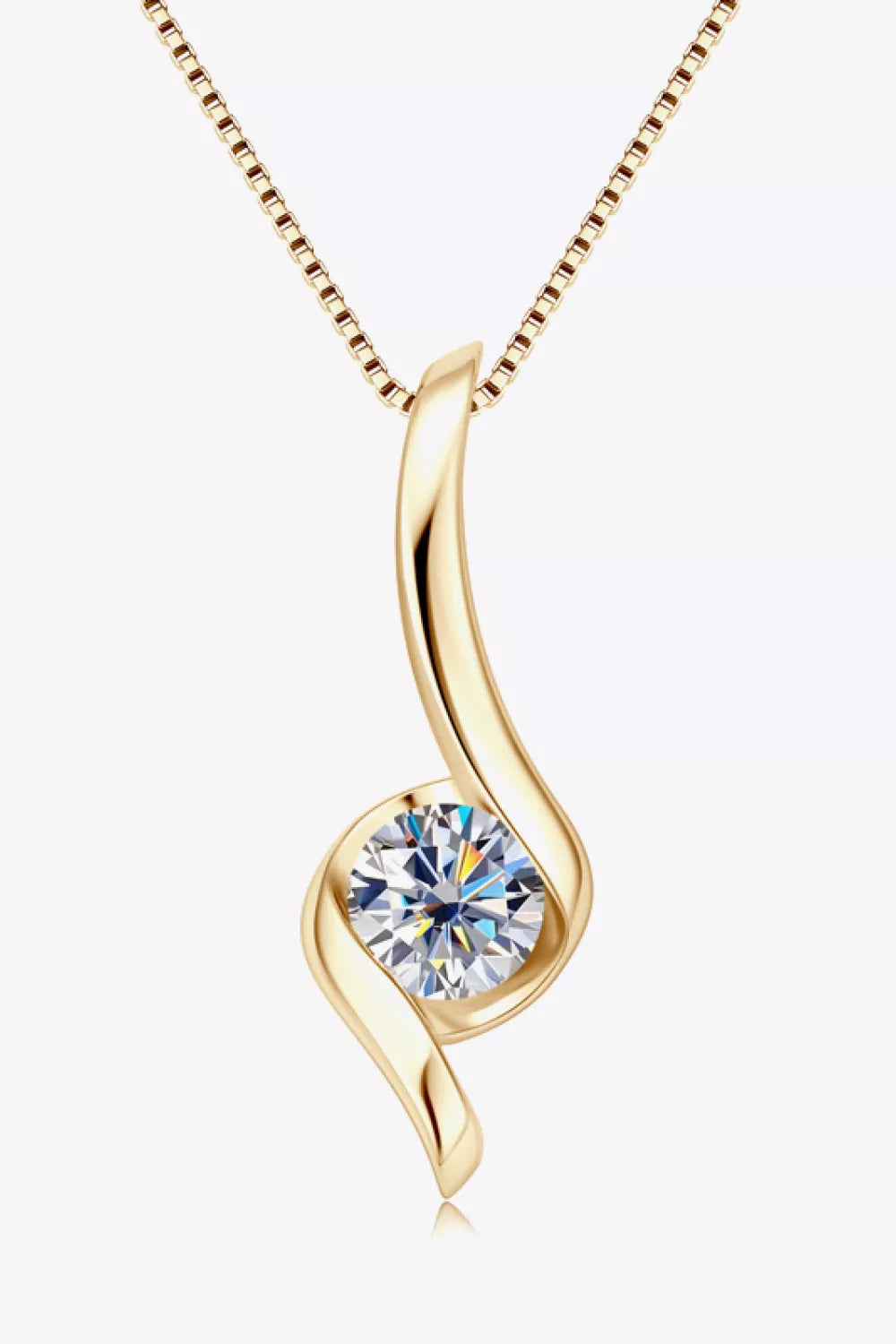 Gold pendant necklace with a clear gemstone on a white background