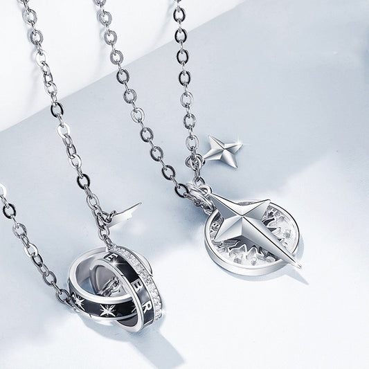 Silver necklaces with pendants on a light gray background