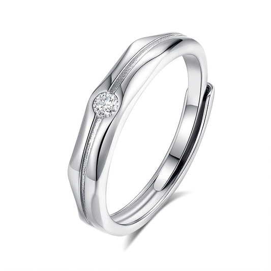 Silver ring with a diamond on a white background