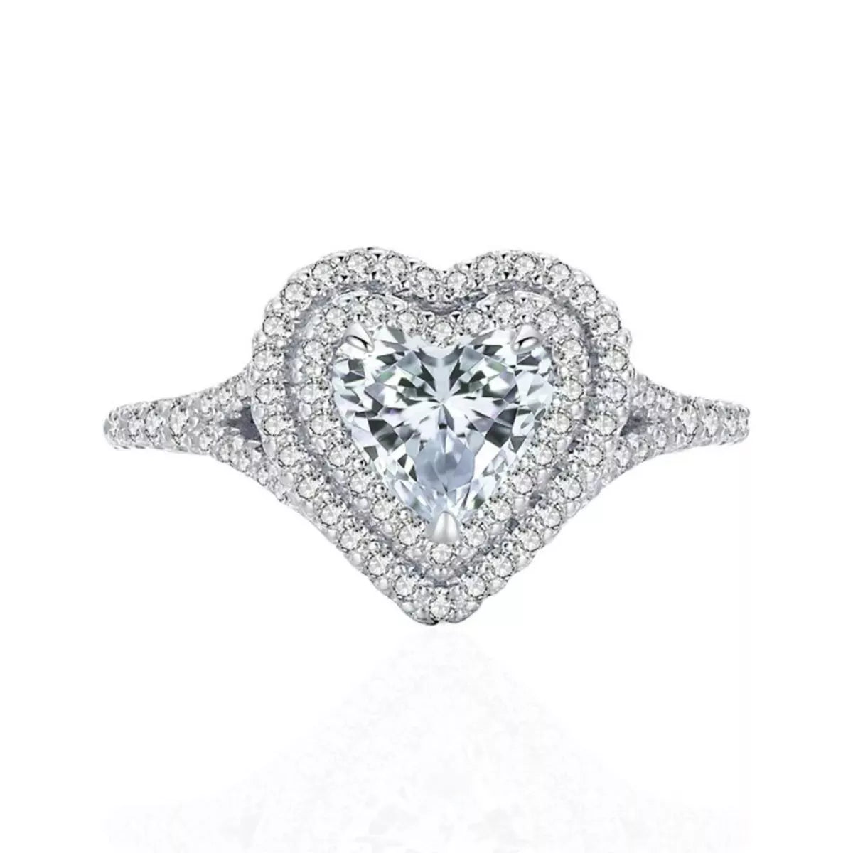 Heart-shaped diamond ring with a clear gemstone on a white background