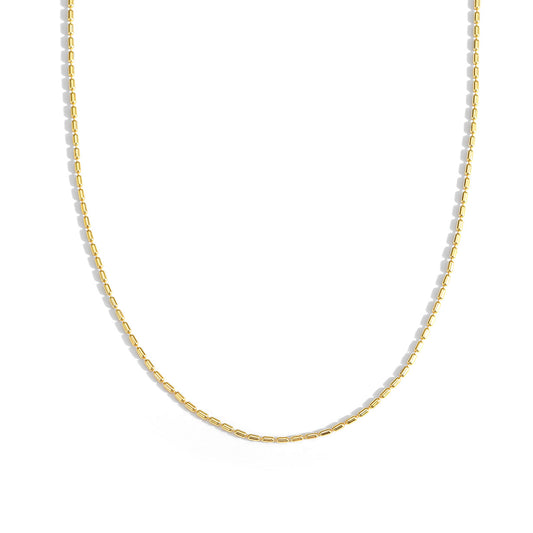 Gold chain necklace on a white background