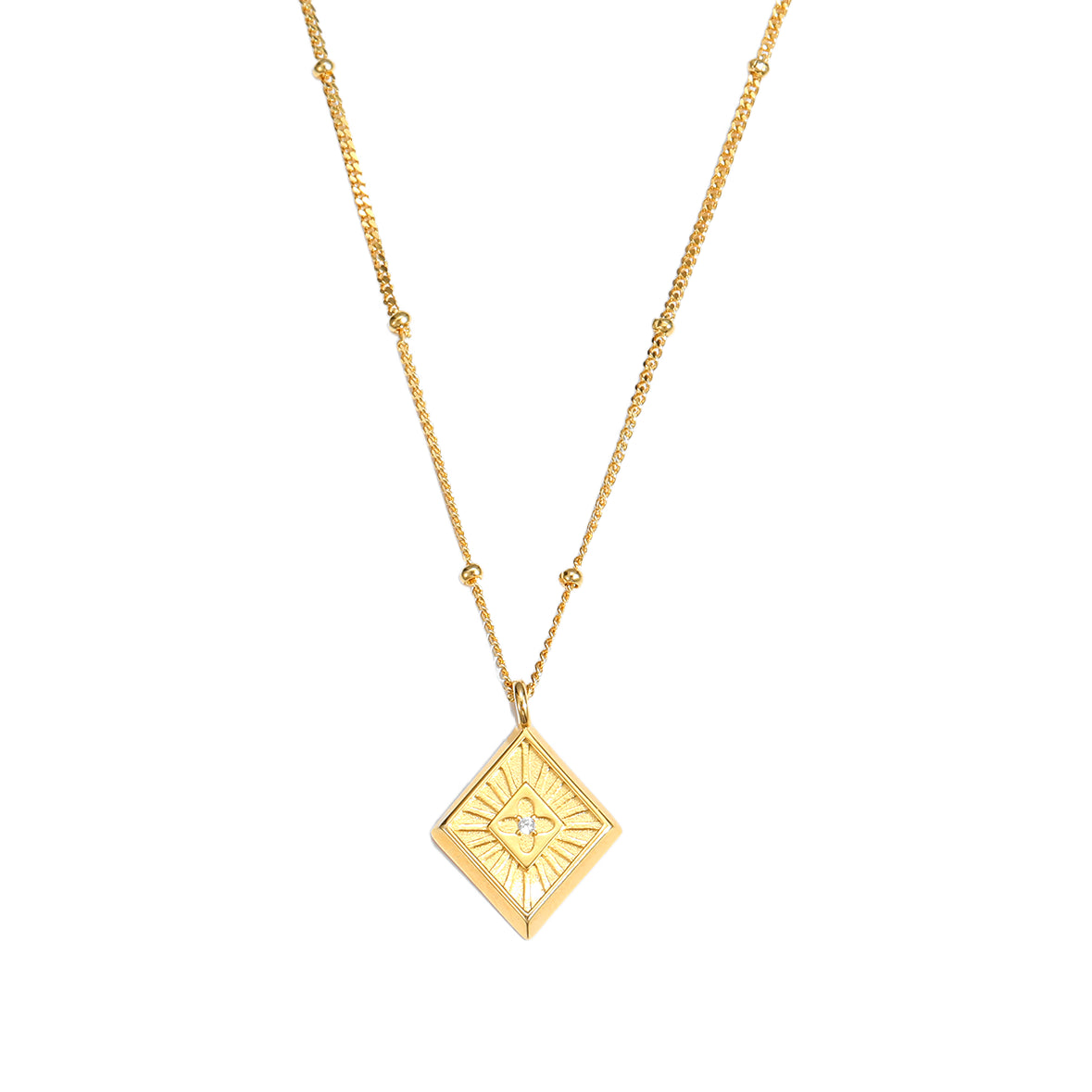 Gold necklace with a geometric pendant on a white background