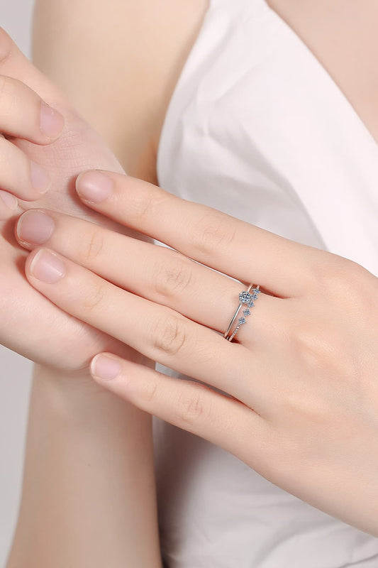 Close-up of a minimalist Moissanite 925 Sterling Silver Two-Piece Stackable Ring Set on a hand | Le'Var Neilson Jewelry