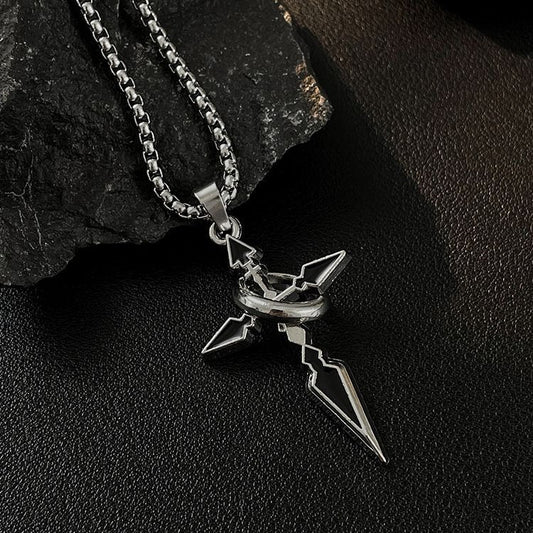 Silver pendant necklace on a dark stone surface