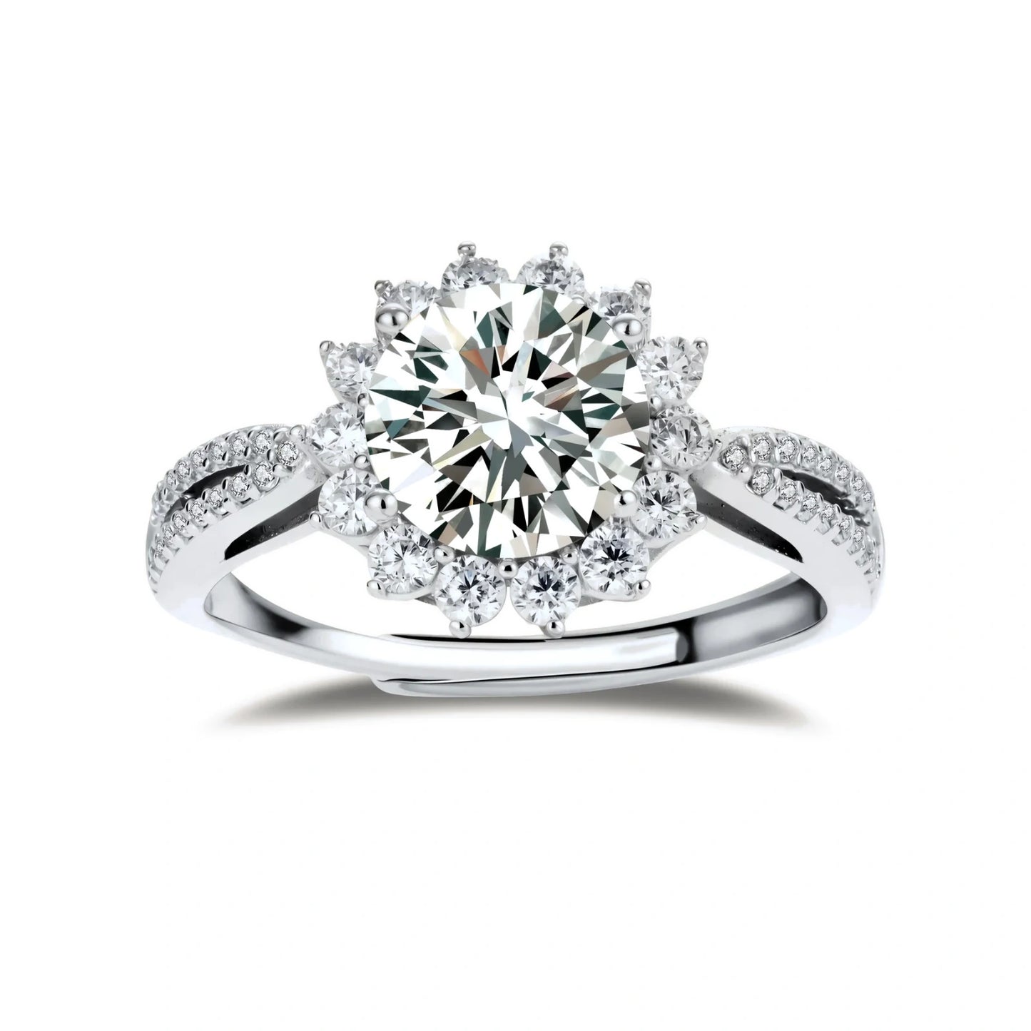 Close-up of sterling silver halo ring with brilliant round moissanite center stone surrounded by smaller accent stones