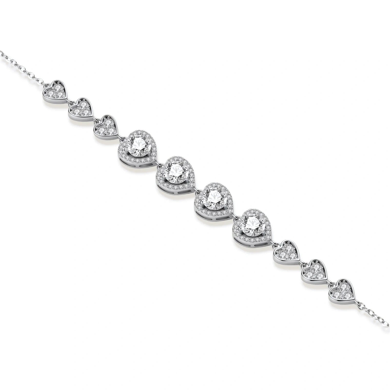 Complete jewelry set with heart-shaped sterling silver pieces featuring brilliant moissanite stones on white background.