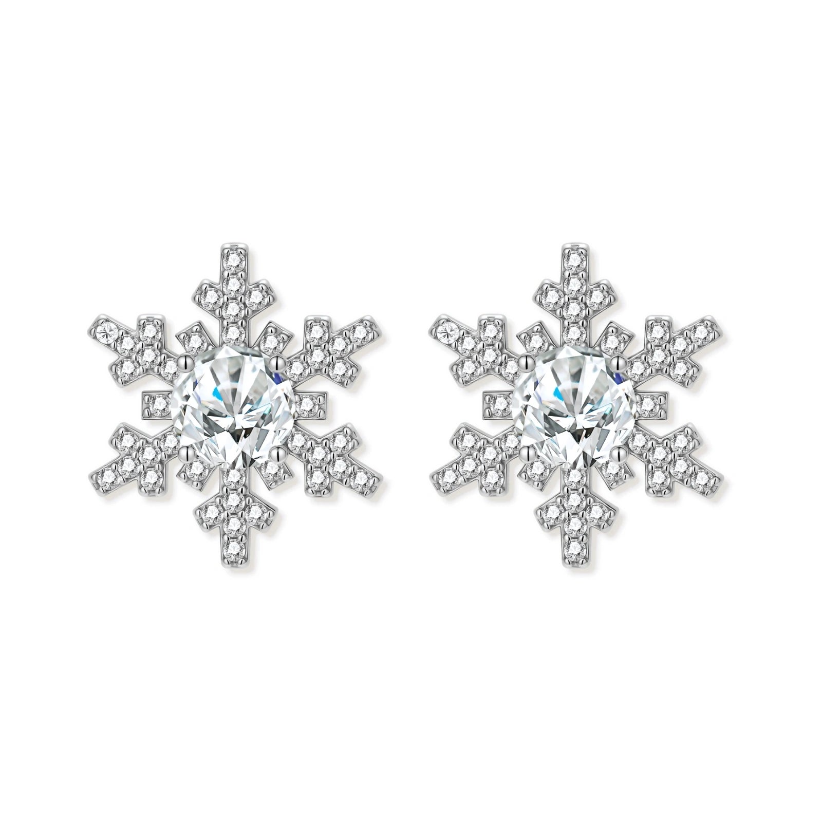 Sterling silver snowflake stud earrings with brilliant moissanite centers and intricate geometric patterns on cream background