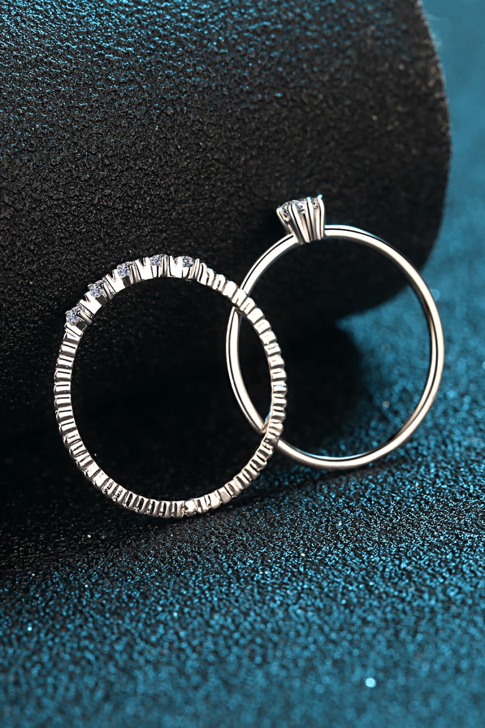 Close-up of a delicate pavé moissanite stacking band in 925 sterling silver on a hand | Le'Var Neilson Jewelry