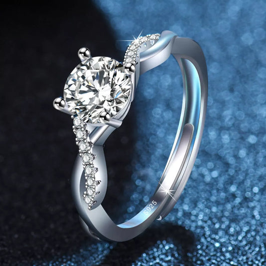 Silver ring with a diamond on a blue and black gradient background