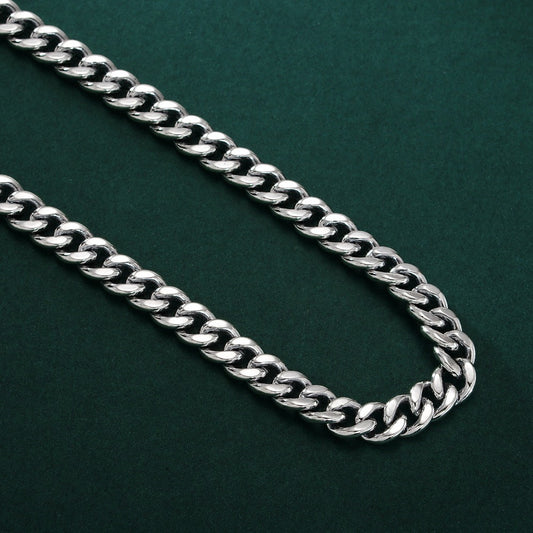 Silver chain on a dark green background