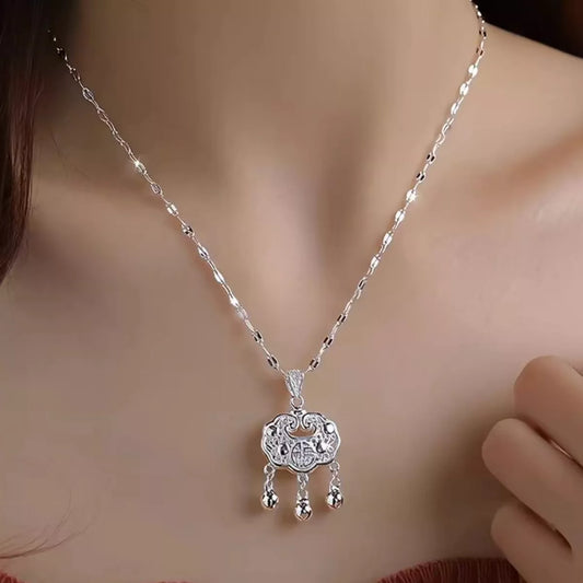 Silver necklace with a pendant on a mannequin