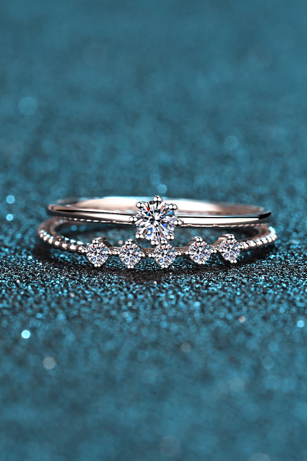 Close-up of a Moissanite Solitaire Ring and Chevron Band Stack Set in 925 Sterling Silver | Le'Var Neilson Jewelry