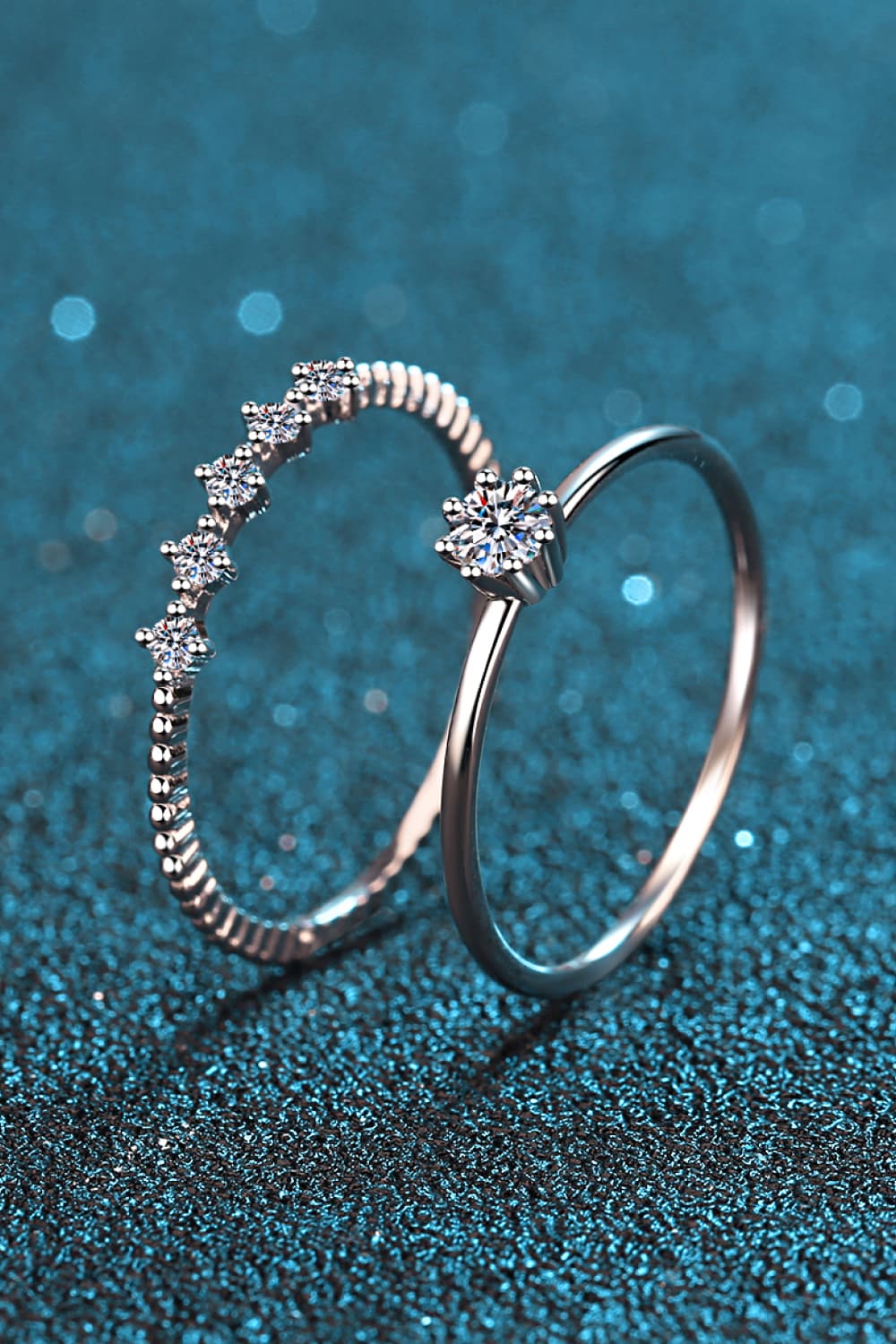 Close-up view of a Moissanite Solitaire Ring paired with a matching pavé infinity eternity band in 925 sterling silver | Le'Var Neilson Jewelry