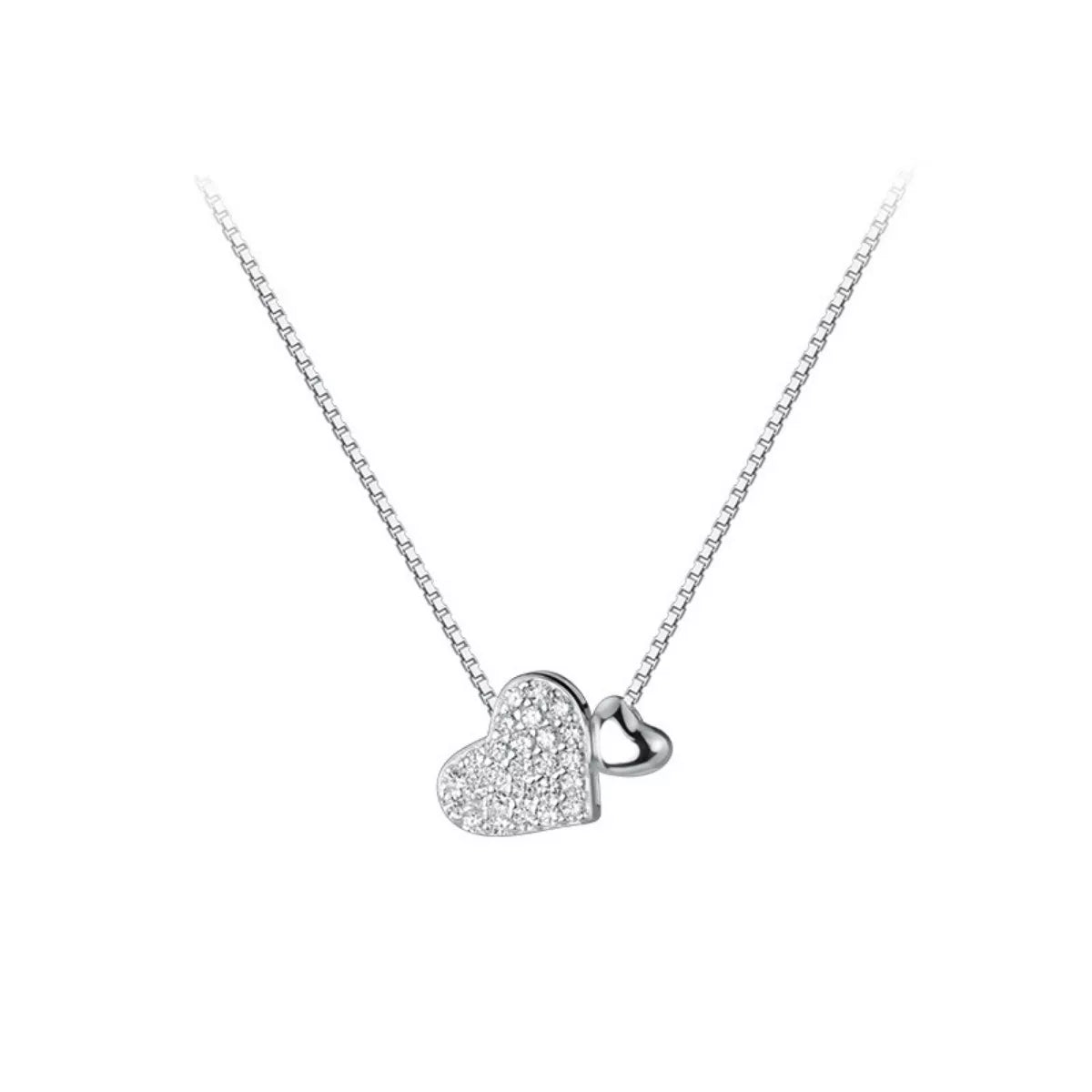 Silver heart-shaped pendant necklace on a white background