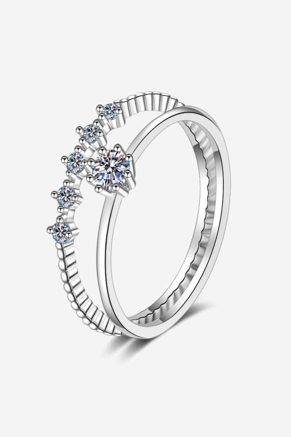 Close-up of a delicate Moissanite Solitaire Ring in 925 Sterling Silver on a hand | Le'Var Neilson Jewelry