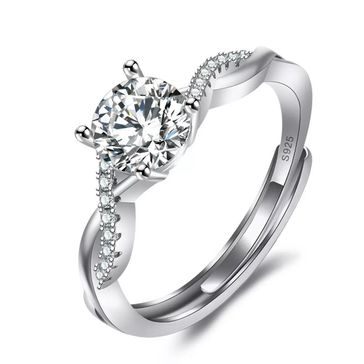 Silver ring with a large diamond and smaller diamonds on the band against a white background