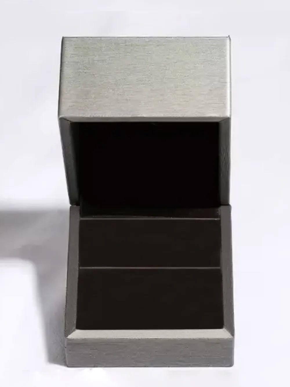 Silver jewelry box with a black interior on a white background