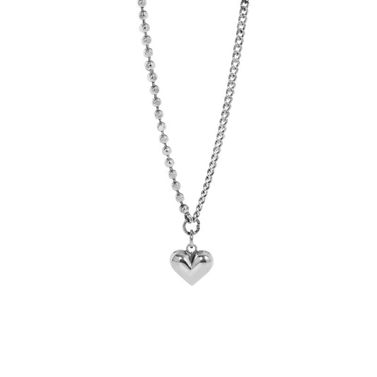 Silver heart pendant necklace on a white background