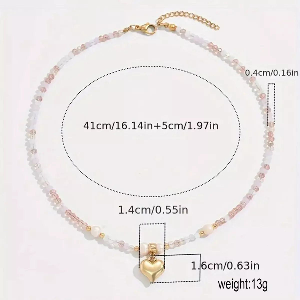 Necklace with heart-shaped pendant and measurement details on a white background