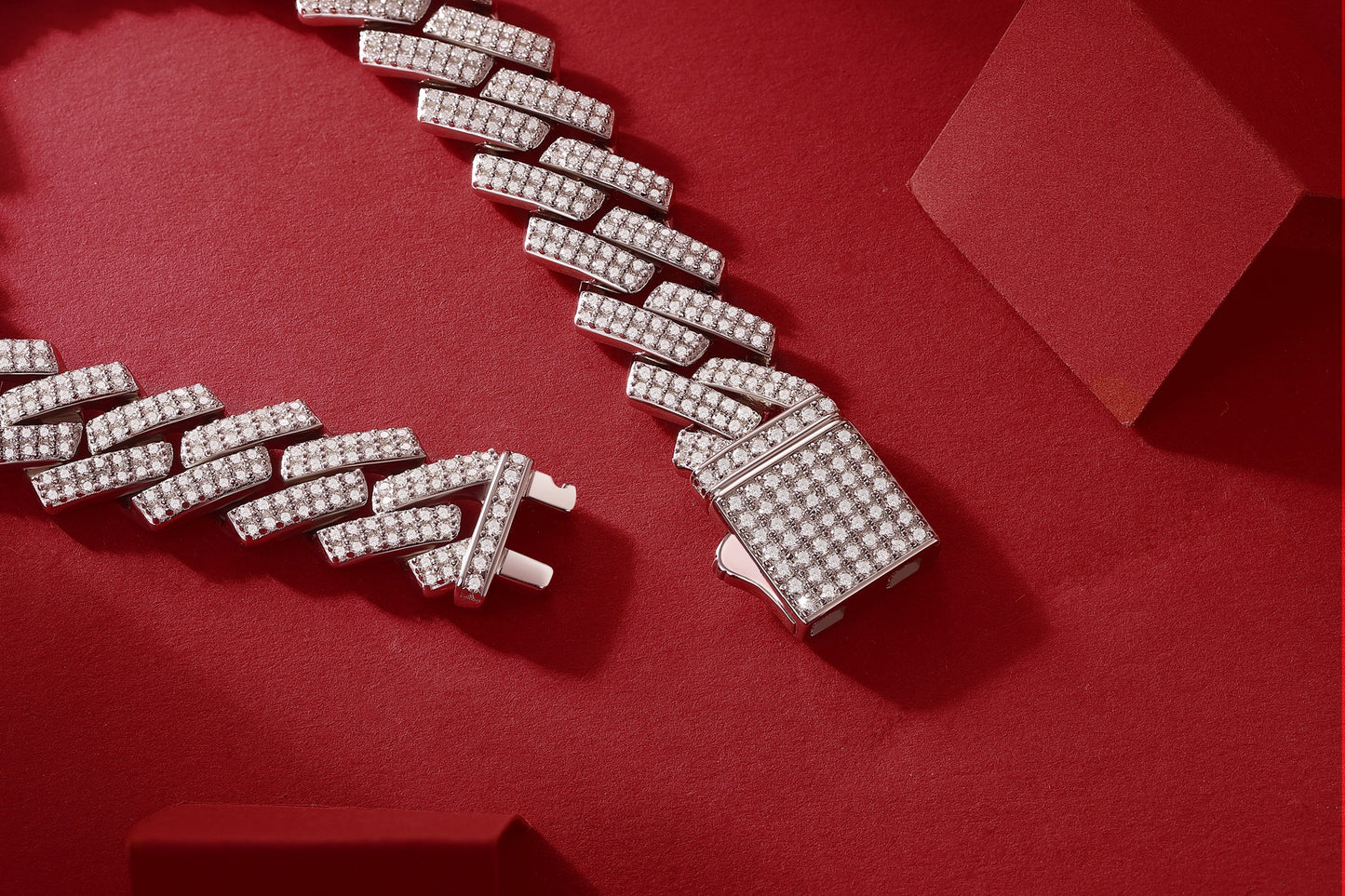 Silver bracelet with diamond accents on a red background