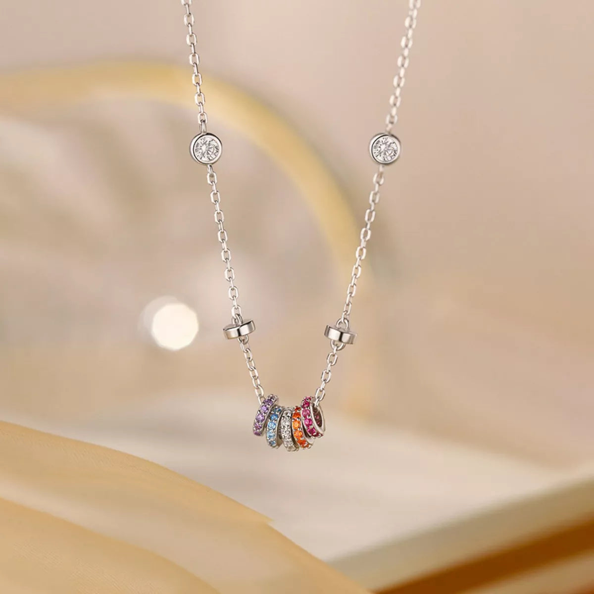 Necklace with colorful beads on a soft beige background
