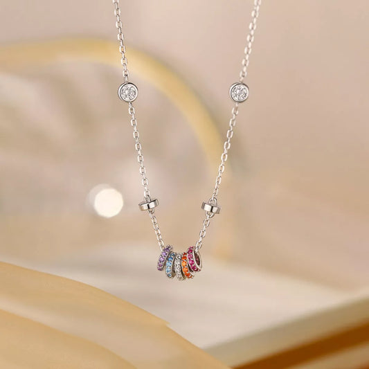 Necklace with colorful beads on a soft beige background