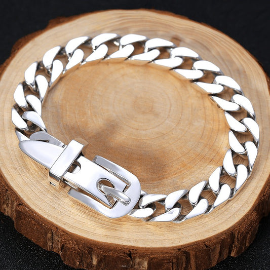 Silver chain bracelet on a wooden surface