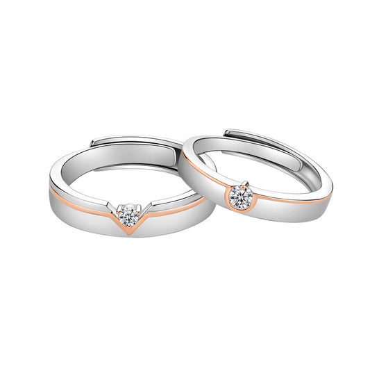 Two silver rings with small diamonds on a white background