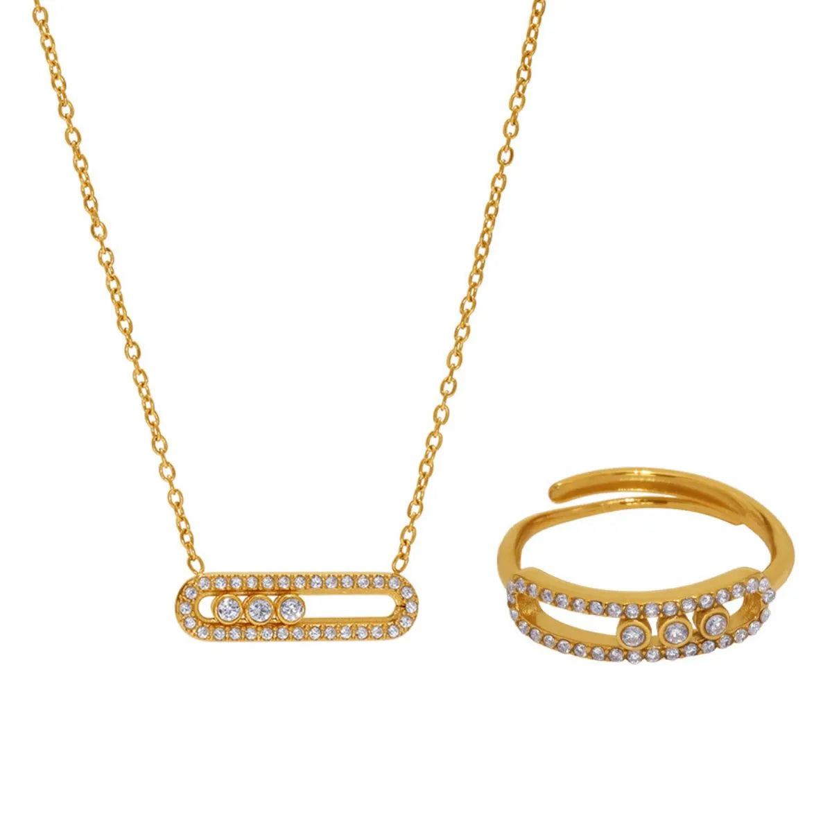 Gold necklace and ring set on a white background