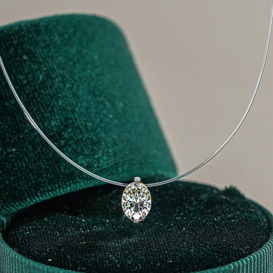 Necklace with a diamond pendant on a green velvet stand