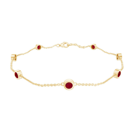 Gold bracelet with red gemstones on a white background
