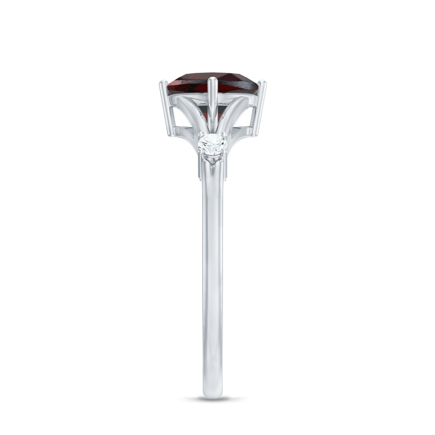 Silver ring with a red gemstone on a white background