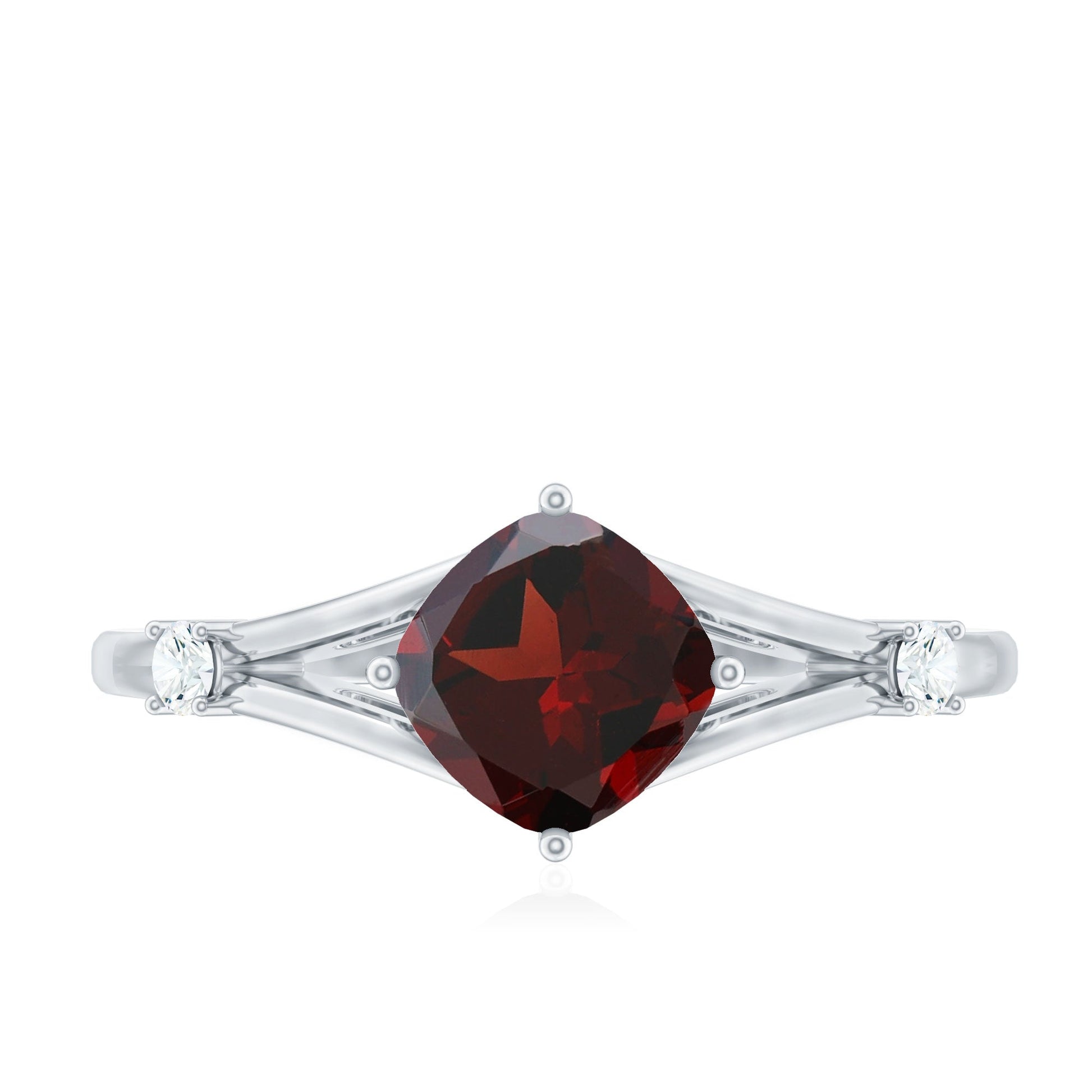 Silver ring with a red gemstone on a white background