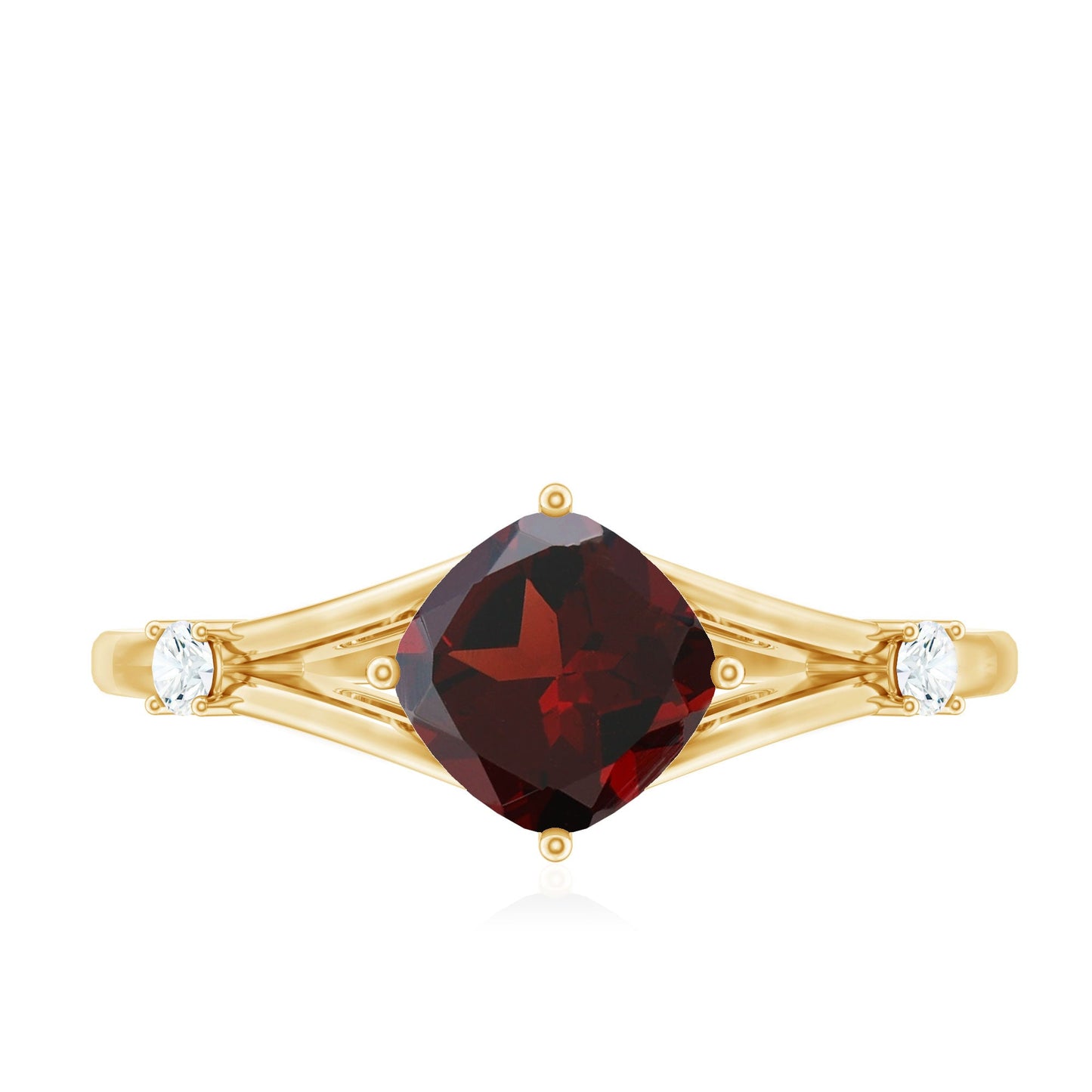Gold ring with a red gemstone and two smaller clear stones on a white background