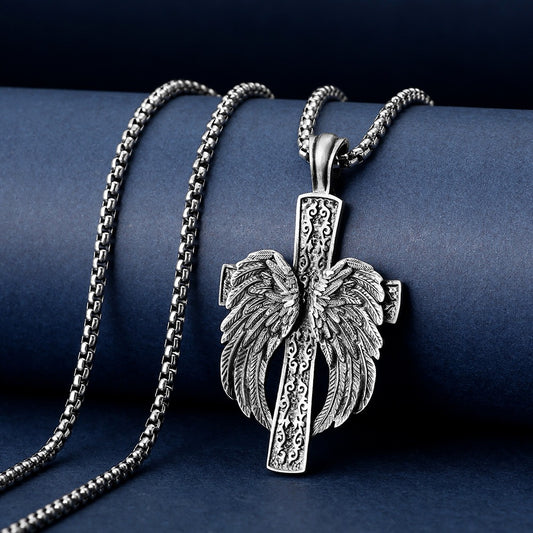 Silver necklace with a detailed pendant on a dark blue background