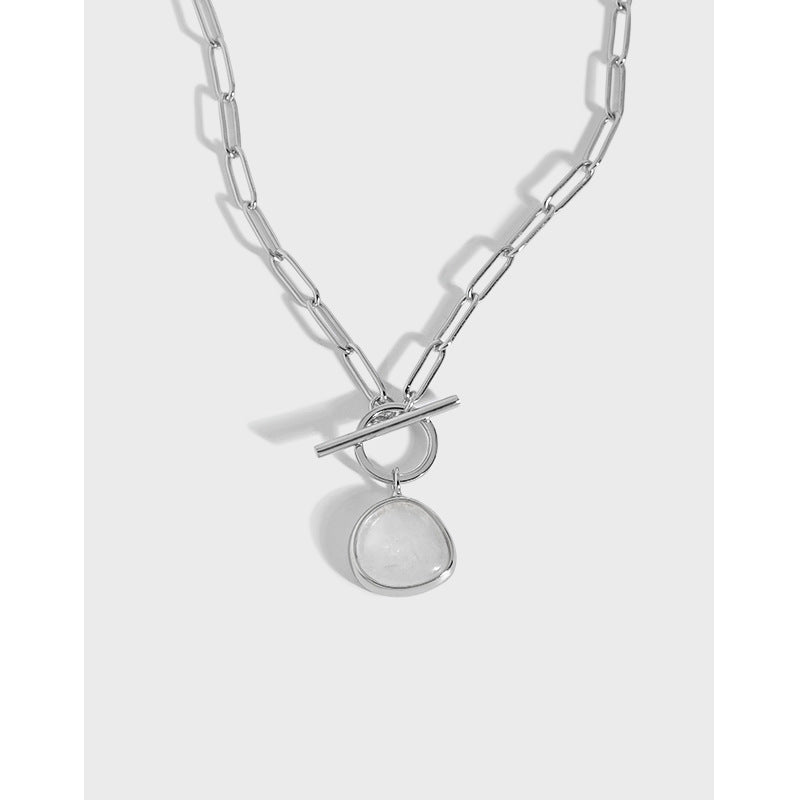 Silver chain necklace with a pendant on a white background