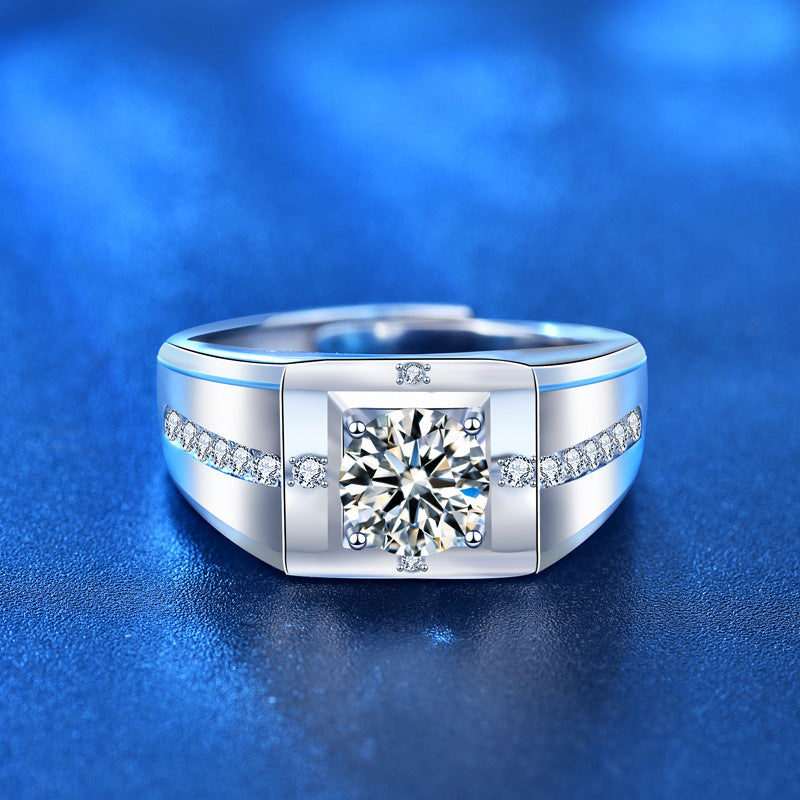 Silver ring with a large diamond and smaller diamonds on a blue background