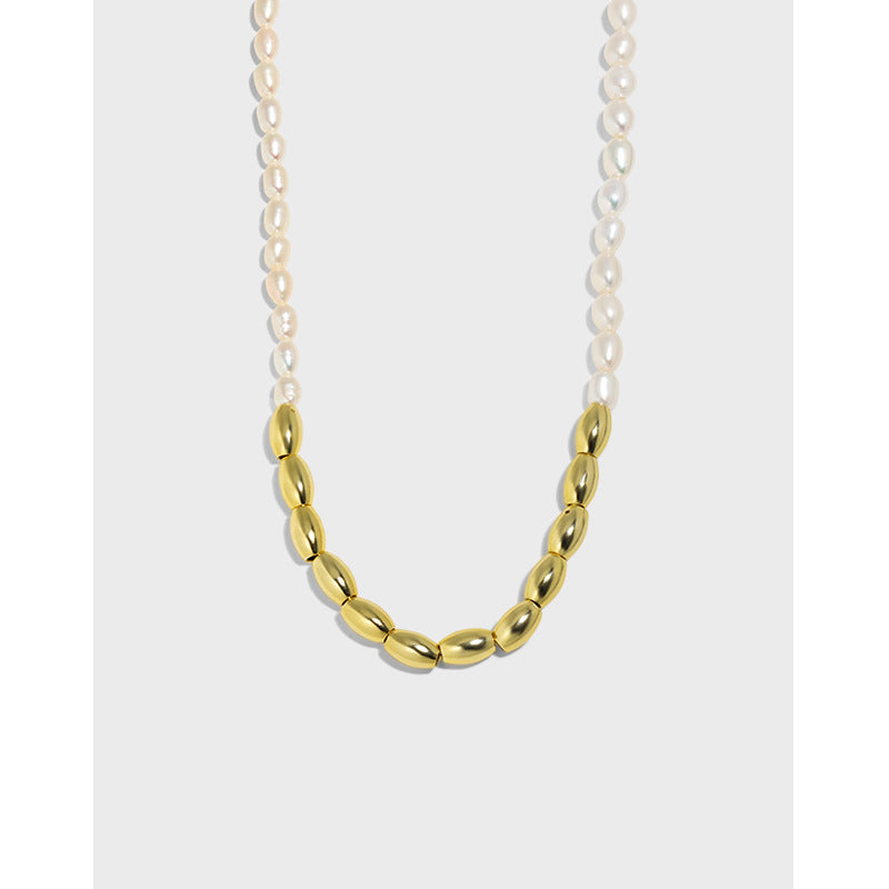Gold and silver chain necklace on a white background