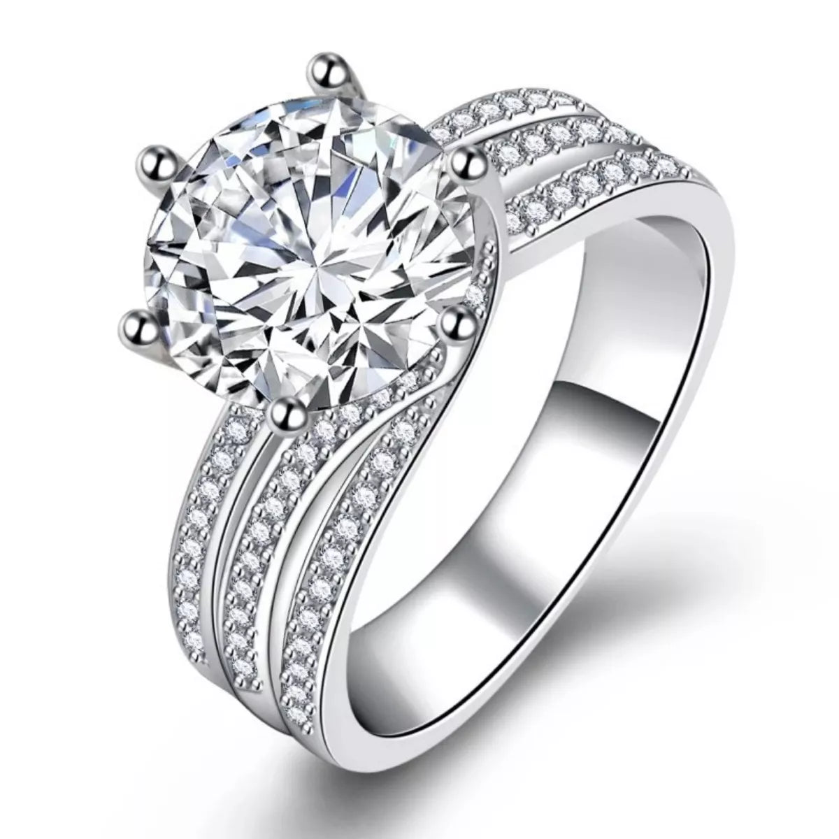 Silver ring with a large diamond and smaller diamonds on the band against a white background