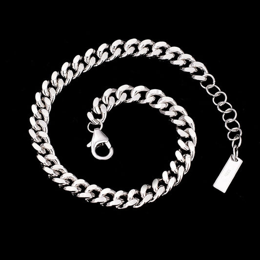 Silver chain with clasp on a black background