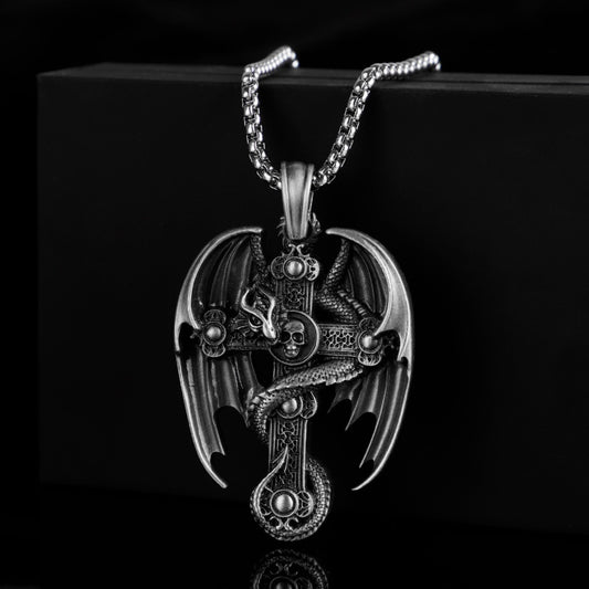 Silver dragon pendant necklace on a black background