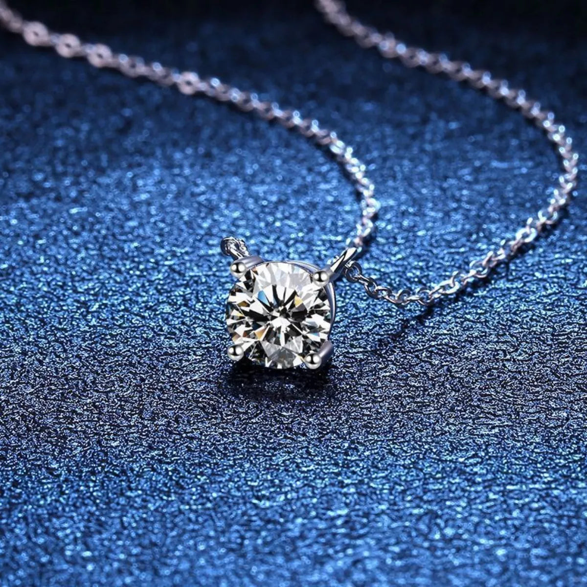 Diamond necklace on a textured blue surface