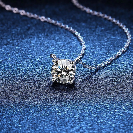 Diamond necklace on a textured blue surface
