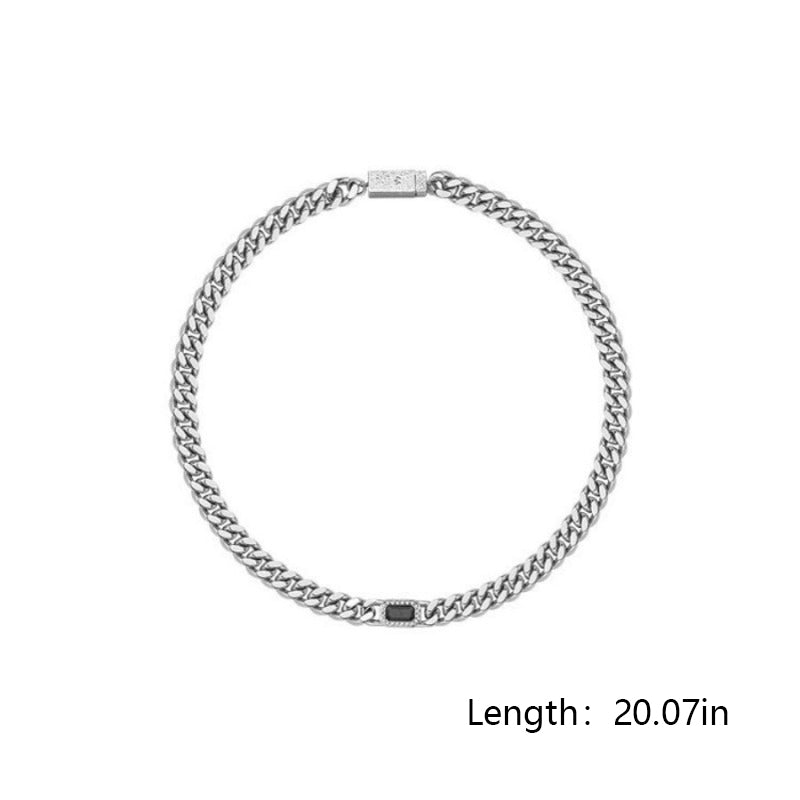 Silver chain necklace on a white background with length measurement