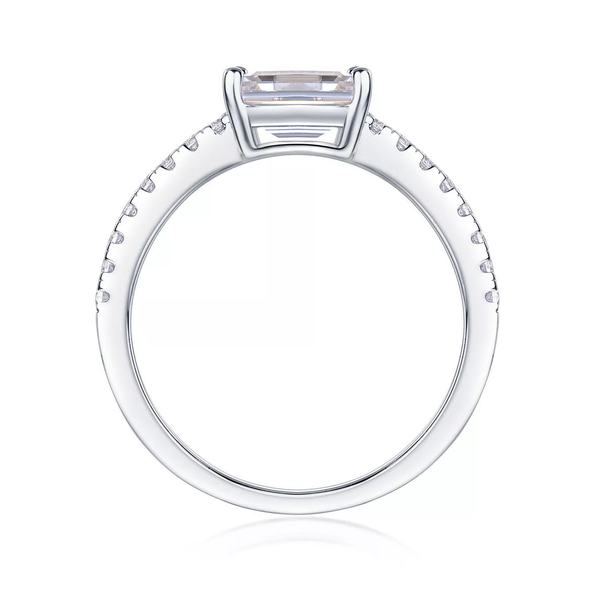 Diamond ring with a rectangular center stone on a white background